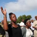 Worshipers hold Sunday service in parking lot